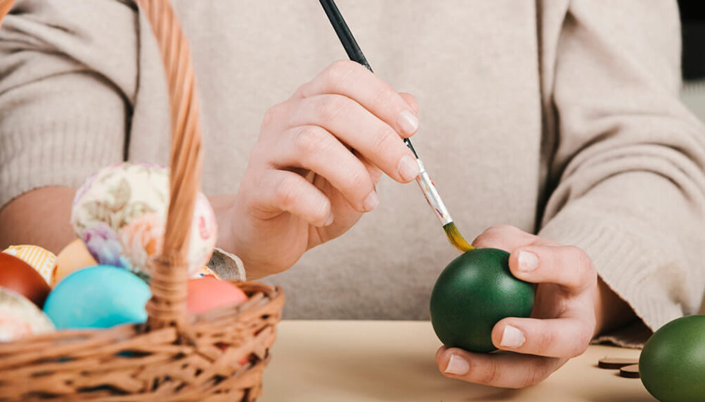 front-view-woman-decorating-easter-eggs (1)